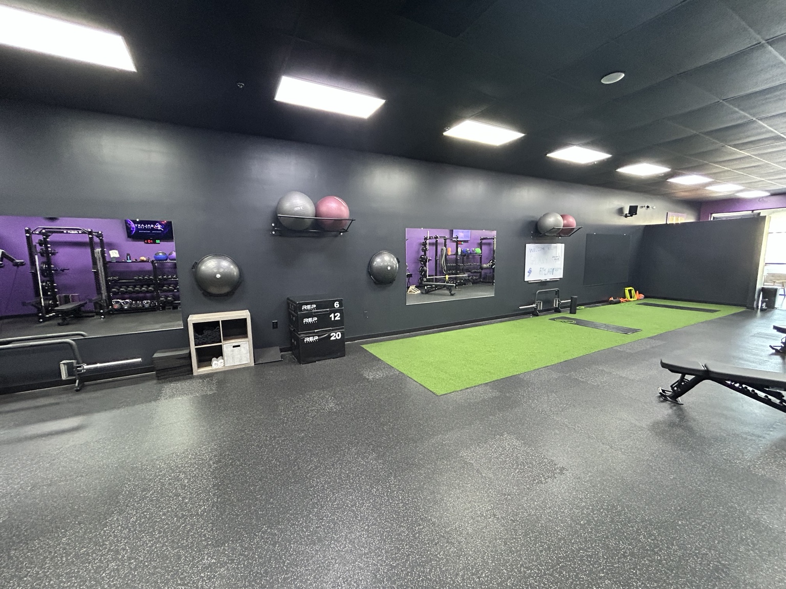 Private personal training studio in North Naples with strength equipment and open turf space